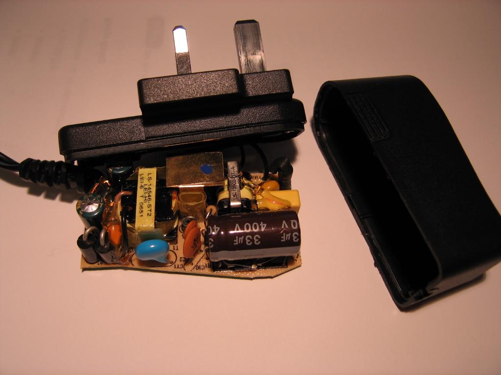 A photo of the NSLU2 power supply cracked open, showing the internal circut board